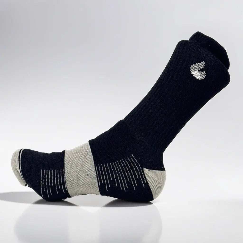 Black and grey tennis crew socks with Active Arc compression, seamless toe design, and ankle protection for enhanced performance and comfort.