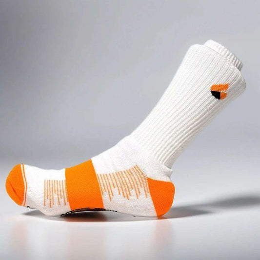 White and orange tennis sock with Active Arc metatarsus compression and seamless toe design for enhanced performance.