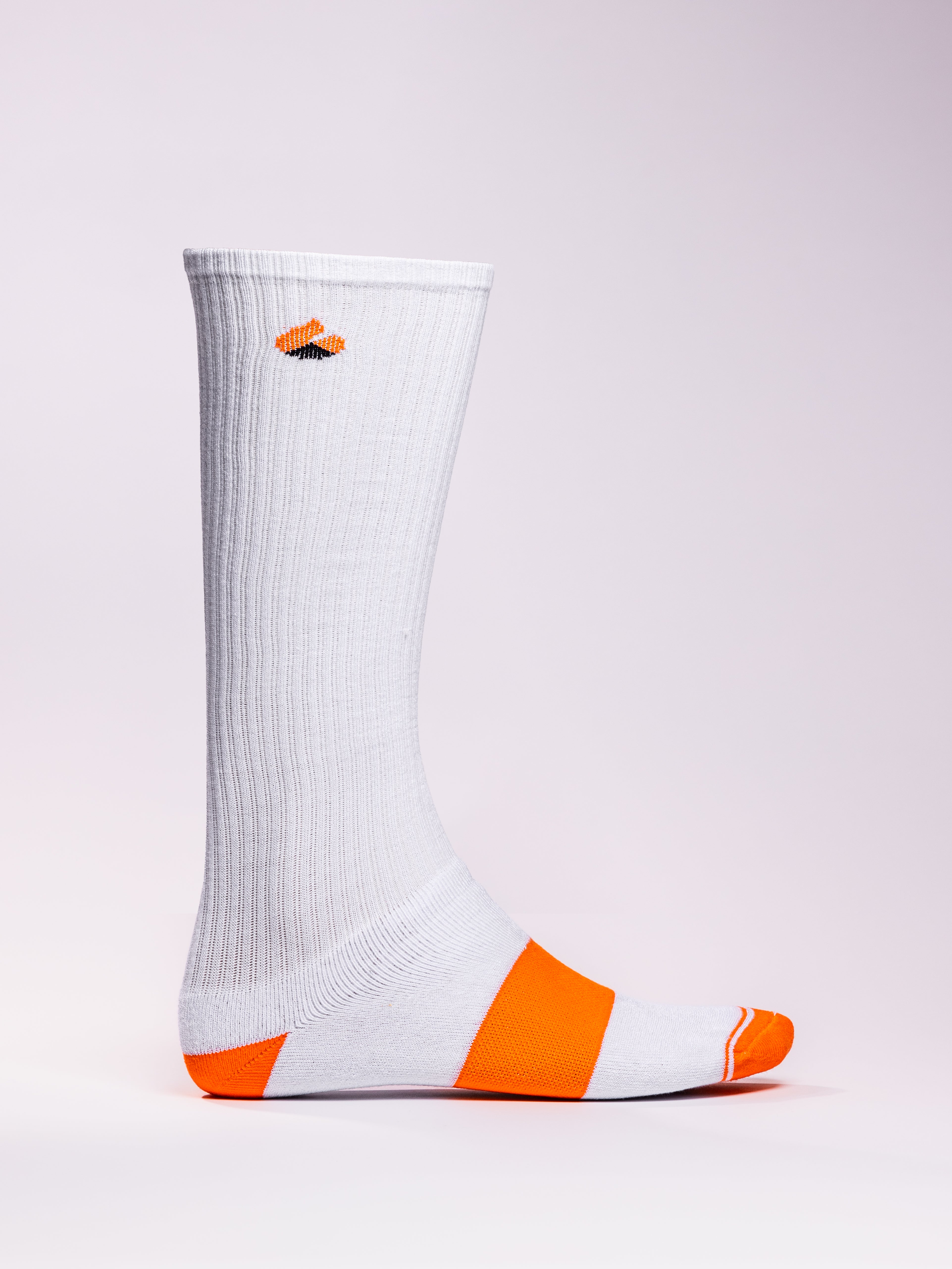 White and orange compression socks with moisture-wicking, arch support, and seamless toe design.